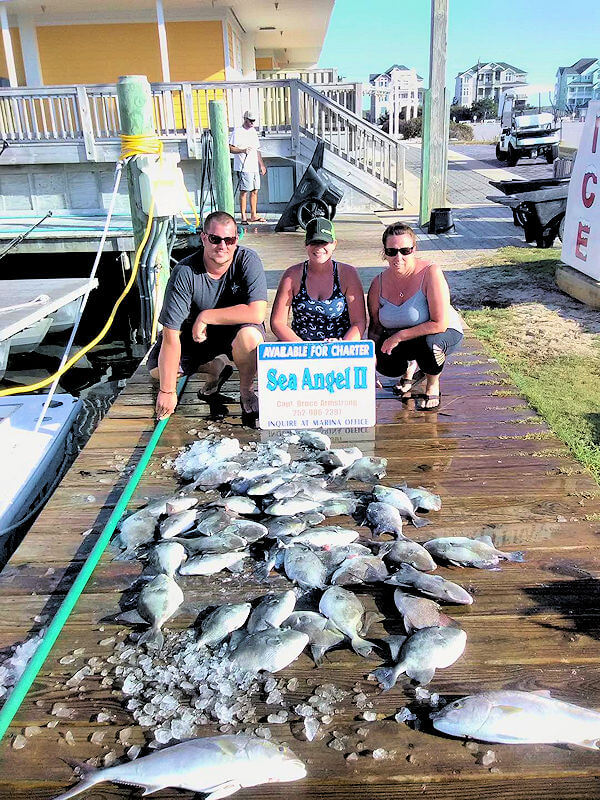 Hatteras charter group shows off their catch.