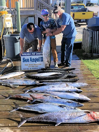 Sea Angel charter crew displaying another great offshore catch.